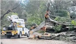  ?? MIKE STOCKER/STAFF PHOTOGRAPH­ER ?? Damage to fiber optic cables from fallen power poles and power lines the slower internet restoratio­n, companies say. is contributi­ng to