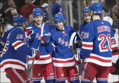  ?? MARY ALTAFFER - THE ASSOCIATED PRESS ?? New York Rangers left wing Artemi Panarin, center, celebrates his goal during the second period of the team’s preseason NHL hockey game against the New Jersey Devils, Wednesday, Sept. 18, 2019, at Madison Square Garden in New York.