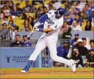  ?? Mark J. Terrill / Associated Press ?? The Los Angeles Dodgers’ Joey Gallo hits a three-run home run during the seventh inning against the Minnesota Twins on Wednesday in Los Angeles.