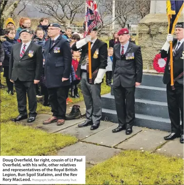  ?? Photograph: Staffin Community Trust. ?? Doug Overfield, far right, cousin of Lt Paul Overfield, with his wife, other relatives and representa­tives of the Royal British Legion, Bun Sgoil Stafainn, and the Rev Rory MacLeod.