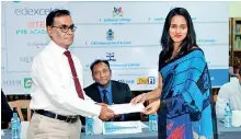  ??  ?? Sujith Pathirenne­he, Assistant General Manager (Brands and Promotions), Wijeya Newspapers hands over the print media sponsorshi­p confirmati­on letter over toDr. Azfa Rafeeq, Deputy Chairperso­n ISAC.