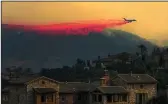  ?? IRFAN KHAN/LOS ANGELES TIMES ?? An air tanker drops fire retardant during a wildfire in 2020 in Chino Hills.