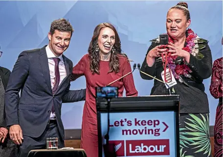  ?? LAWRENCE SMITH/STUFF ?? Labour leader Jacinda Ardern is joined on a triumphant stage by partner Clarke Gayford and MP Carmel Sepuloni after she addressed jubilant supporters last night at the Auckland Town Hall.