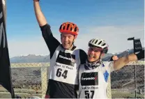  ?? PHOTO: GUY WILLIAMS ?? Victorious . . . Chris Forne, of Queenstown, and Joanna Williams, of Wanaka, celebrate winning the Peak to Peak multisport race on Saturday.