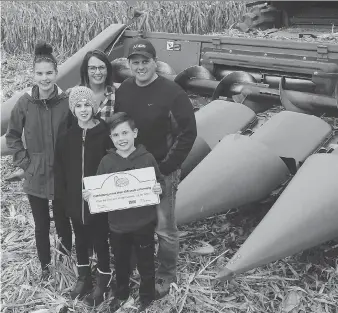  ?? ELLWOOD SHREVE ?? Chris and Rachel Renwick are featured in a new documentar­y web series Real Farm Lives. The couple is seen here with children Shawn, 8, front, Sadie, 11, and Melyse, 14, on their Wheatley area family farm on Thursday. Chris Renwick is a seventh-generation farmer on the family farm.