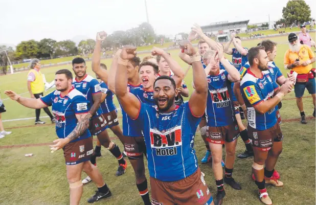  ?? Picture: STEWART MCLEAN ?? CROWING: Atherton players celebrate a tough win against Yarrabah to proceed to next week’s preliminar­y final.