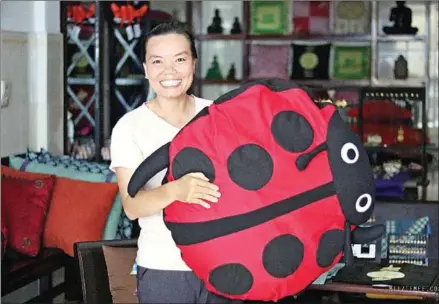  ?? SUPPLIED ?? Ky Kanary – the founder of the Cambodia Women’s Support Group – holds a plush ladybug sewn by a member.