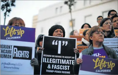  ?? Picture: REUTERS ?? GRAVE CONCERN: The Coalition for Humane Immigrant Rights of Los Angeles hold a vigil at City Hall as they respond to President Donald Trump's executive orders on immigratio­n in Los Angeles, California on Wednesday