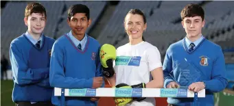  ??  ?? Irish boxer Mary-Kate Slattery with Summerhill College’s Adam Wynne, Christophe­r Lob &amp; Danny Cronin.