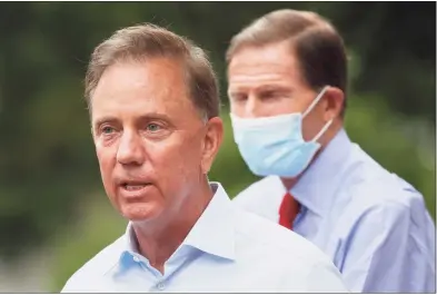  ?? John Minchillo / Associated Press ?? Unpaid suspension­s will begin on Friday for as many as 671 unionized state workers who have not complied with Gov. Ned Lamont’s vaccinatio­n-or-test order.