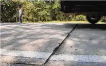  ?? Elizabeth Conley/Staff photograph­er ?? Cement road pulls apart Thursday on Cochran’s Crossing in The Woodlands.