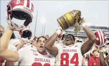  ?? Michael Conroy / Associated Press ?? Indiana, the 2019 winner, and in-state and Big Ten archrival Purdue traditiona­lly play for the Old Oaken Bucket, but Friday’s renewal has been canceled for the third time this season.