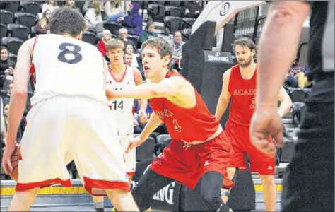  ?? ANDY CAMPBELL, UNB SPORTS INFORMATIO­N OFFICER ?? First-year Axeman Brett Speedy keeps his eye on the action against the UNB Varsity Reds. Speedy, a Fredericto­n native, had a bit of a family reunion while on the road with Acadia – his father coaches the UNB women’s basketball team.