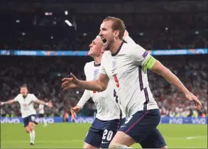  ?? Laurence Griffiths / Associated Press ?? England’s Harry Kane celebrates with Phil Foden after scoring their side’s second goal during the UEFA Euro 2020 Championsh­ip semifinal match against Denmark at Wembley Stadium in London.