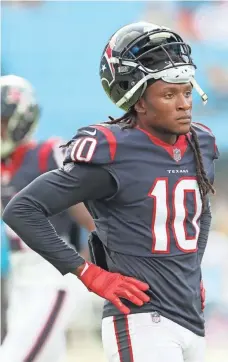  ?? JIM DEDMON, USA TODAY SPORTS ?? DeAndre Hopkins, along with Texans teammates, spent Sunday distributi­ng supplies to people affected by Hurricane Harvey.
