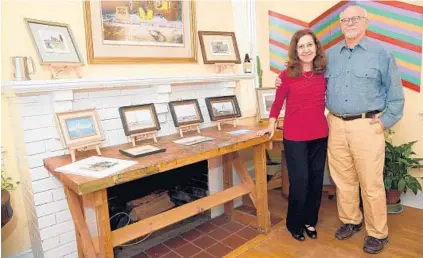  ?? PAUL W. GILLESPIE/BALTIMORE SUN MEDIA GROUP ?? Alexandra Fotos and Neil Harpe stand next to some of the art that fills their Murray Hill home.