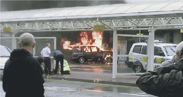  ?? PICTURE: ALISTAIR ROBERTSON/PA ?? The Jeep was driven into doors at the west end of Glasgow Airport’s terminal on one of its busiest days of the year