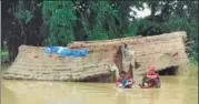  ??  ?? AFP Nepalese army personnel rescue flood victims at Nawalparas­i, some 200 km southwest of Kathmandu, on Tuesday.