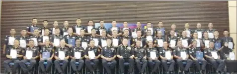  ??  ?? The award recipients pose for a group photo with Khaw (seated eighth left).