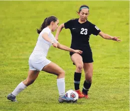  ?? ADOLPHE PIERRE-LOUIS/JOURNAL ?? Los Lunas’ Brooke Halverson, left, battles Hope Christian’s Tedi Del Prete for possession of the ball. Hope Christian was one of three quarterfin­alists with resounding shutout victories in Wednesday’s quarterfin­al action.