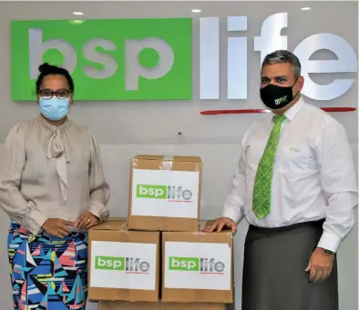  ??  ?? BSP Life Managing Director Michael Nacola, (right) on behalf of the BSP Fiji Group hands over $10,000 worth of equipment and supplies to Ministry of Health’s Incident Management Team (IMT) General Manager, Dr. Anaseini Maisema (left) at the BSP Life Boardroom in Suva.