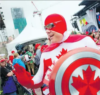  ??  ?? Captain Canada strolled through the crowd on Parliament Hill during the Canada Day show Wednesday.