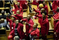  ?? AP ?? Members of the Economic Freedom Fighters party disrupt Parliament proceeding­s at the State of the Nation Address in Cape Town, South Africa.