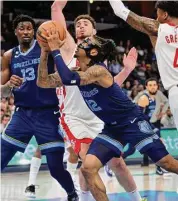  ?? Brandon Dill/Associated Press ?? In his first action after a nine-game absence, Grizzlies guard Ja Morant scored 17 points off the bench.