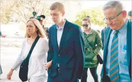  ?? Dan Honda Bay Area News Group ?? BROCK TURNER, 20, center, heads into court for his sentencing hearing in Palo Alto, Calif. Court documents depict Turner as not simply making a bad choice, but having a penchant of making aggressive advances on women.