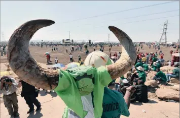  ?? PHOTO: PHILL MAGAKOE ?? Associatio­n of Mineworker­s and Constructi­on Union members commemorat­e the third anniversar­y of the Marikana killings last week. The writer says when unions promise to deliver voters, politician­s rush to suck up to them.