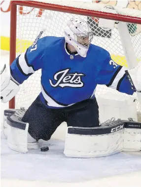  ?? TREVOR HAGAN/THE CANADIAN PRESS ?? Winnipeg Jets goaltender Connor Hellebuyck let in a few softies Tuesday in a 4-3 loss to Pittsburgh.