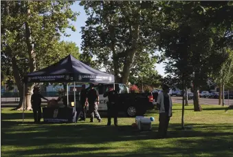  ?? NEWS-SENTINEL PHOTOGRAPH­S BY WES BOWERS ?? The Lodi Police Department had a team of officers at Hale Park to reach out to neighbors in the Heritage District.