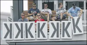  ??  ?? A security guard adds a seventh “K” to Braves starting pitcher Sean Newcomb’s collection of strikeouts Saturday against the Mets at SunTrust Park.