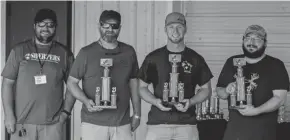  ?? JOSH PREISSNER ?? Sponsor Rob Sherper, left, joins the top three in the adult division of the Wisconsin duck calling competitio­n: Benny Breitkreut­z, right; Adam Myhus, second from right; and Kevin Sadler, third.