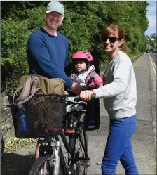  ??  ?? Michael Frawley with his partner Sarah and daughter Ana out for a cycle in KIllarney on Sunday. Photo by Michelle Cooper Galvin