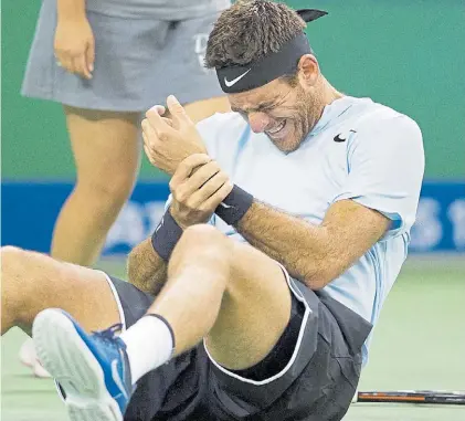  ?? AFP ?? Dolor intenso. A Juan Martín Del Potro le costó seguir el partido que le ganó a Troicki. ¿Jugará hoy?