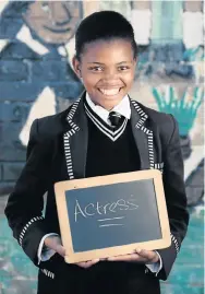  ??  ?? LIGHTS, CAMERA, ACTION!: One of the pupils photograph­ed by the Keep A Dream Alive project, Nelisiwe Sompa, 14