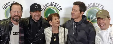  ?? HErald STaFF FilE ?? FAMOUS FAMILY: Alma Wahlberg and four of her sons, Robert, left, Donnie, Mark and Paul pose for a photograph at the opening of a Wahlburger­s location in Dorchester on Dec. 17, 2018.