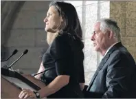  ?? CP PHOTO ?? Foreign Affairs Minister Chrystia Freeland listens as U.S. Secretary of State Rex Tillerson responds to questions during a joint media availabili­ty on Parliament Hill in Ottawa, Tuesday. On Thursday Freeland announced Canada would abstain from a UN...