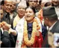  ??  ?? Ms Bhandari (centre) was elected by Nepal’s parliament