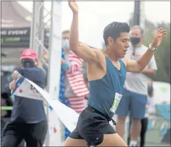  ??  ?? Felipe Garcia crosses the finish line in first place during the inaugural Bloom Energy Stars and Strides 5K/10K charitable walk/run on Aug. 22 in San Jose.