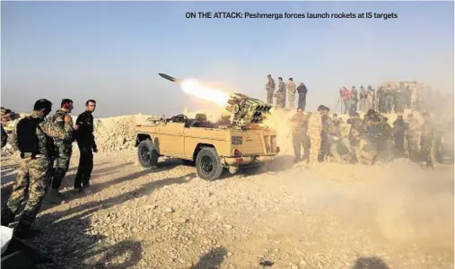  ??  ?? ON THE ATTACK: Peshmerga forces launch rockets at IS targets
