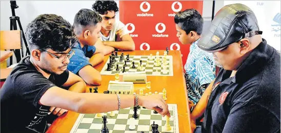  ?? Picture: ATU RASEA ?? Vineet Lal left, participat­es during the 2023 Vodafone Fiji National Blitz Chess Championsh­ip at the Olympic House in Suva.