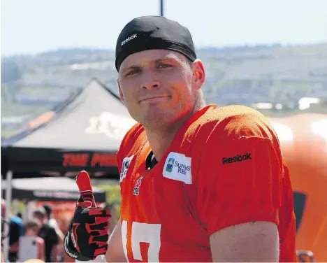  ?? B.C. LIONS PHOTO ?? Lions receiver Austin Collie — who used to catch Peyton Manning’s passes in Indianapol­is — takes a rest at training camp in Kamloops this week.