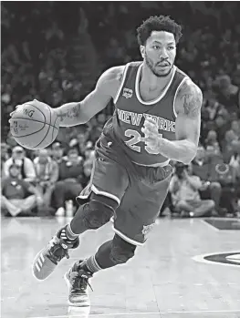  ?? AP Photo/Matt Slocum ?? n New York Knicks’ Derrick Rose drives down court against the Philadelph­ia 76ers on March 3 in Philadelph­ia. A person familiar with the negotiatio­ns said former MVP Derrick Rose agreed Monday to a one-year, $2.1 million contract with the Cleveland...