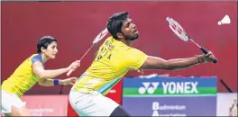  ??  ?? Satwiksair­aj Rankireddy (R) and teammate Ashwini Ponnappa in action during the match