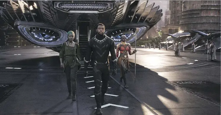  ?? MARVEL STUDIOS ?? Lupita Nyong’o, Chadwick Boseman and Danai Gurira star in Black Panther, the first Marvel movie to feature a black hero and a predominan­tly black cast.