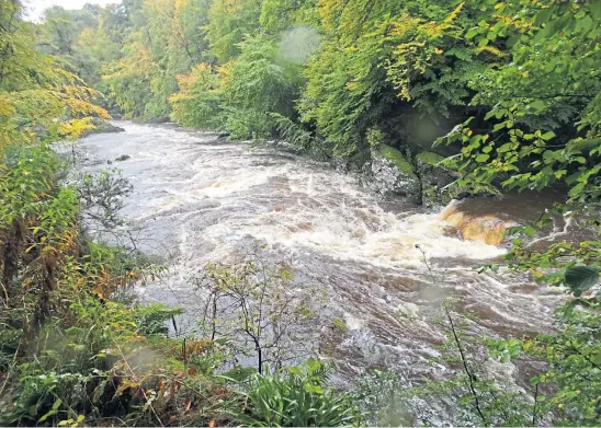  ?? In places. Picture by Angus Whitson ?? WHITE NOISE: After 24 hours of rain, the River North Esk surges over the rocks, rising 30ft