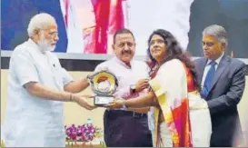  ?? PTI ?? Prime Minister Narendra Modi gives away an award during the Civil Services Day, 2017, function in New Delhi on Friday. Union minister Jitendra Singh (second from left) attended the event.