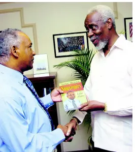  ??  ?? Former Gleaner Sports Editor Tony Becca (left) presents a copy of his book ‘Souvenirs ‘ to former prime minister, P.J. Patterson, in September 2007.